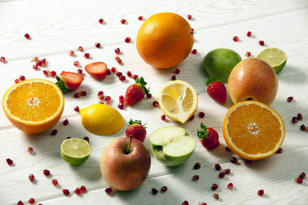 close up of various colorful fruits on wooden table  - Photo, Image