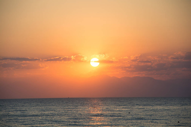Delightful colors of sunset on the sea on the beach , azure coast, beautiful nature - Foto, immagini