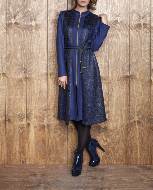 Female model in trendy blue coat, studio shot - Foto, Imagem