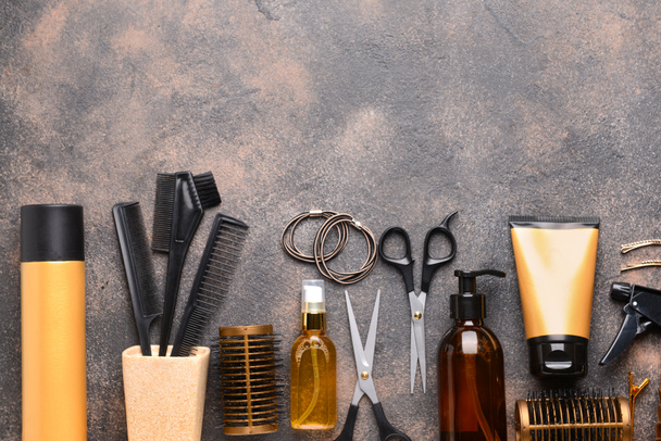 Set of hairdresser tools and accessories on grey background - Фото, зображення