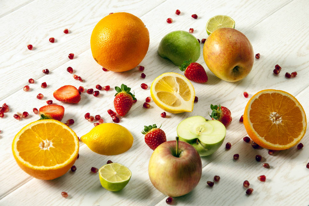 close up of various colorful fruits on wooden table  - Photo, Image