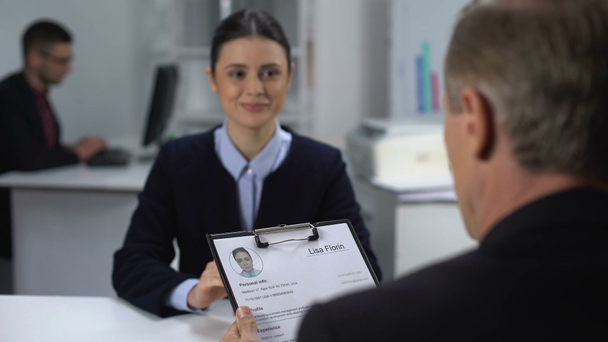 Employer crossing out female applicant name in resume during interview, failure - Footage, Video