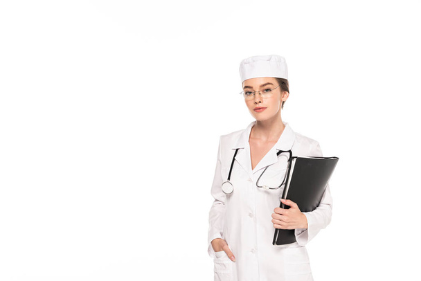 young doctor in white coat with stethoscope and folder isolated on white - Photo, Image