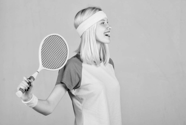 Active leisure and hobby. Tennis sport and entertainment. Girl adorable blonde play tennis. Start play game. Sport for maintaining health. Athlete hold tennis racket in hand. Tennis club concept - Foto, Imagen