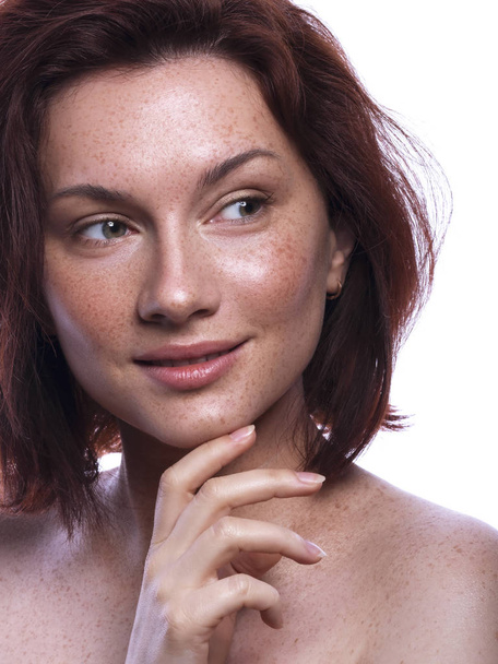 Cute brunette woman with freckles all over her face. Clean flawl - Photo, Image