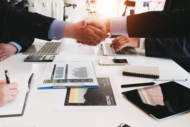 Business people partners shaking hands after complete agreement  - Fotografie, Obrázek