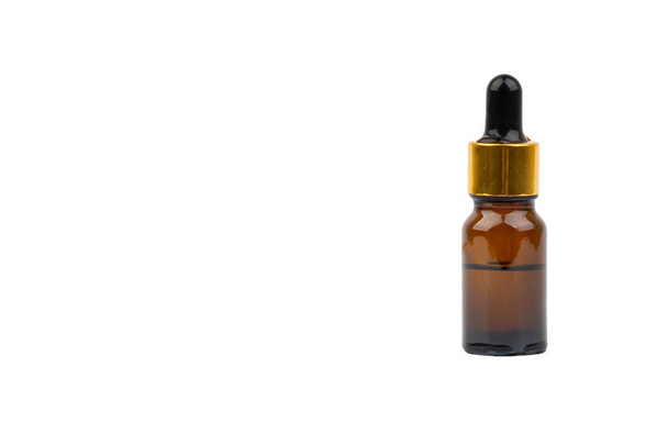 Dropper serum and brown glass bottle isolated on white background. Skin care, drug and cosmetic concept - Photo, Image