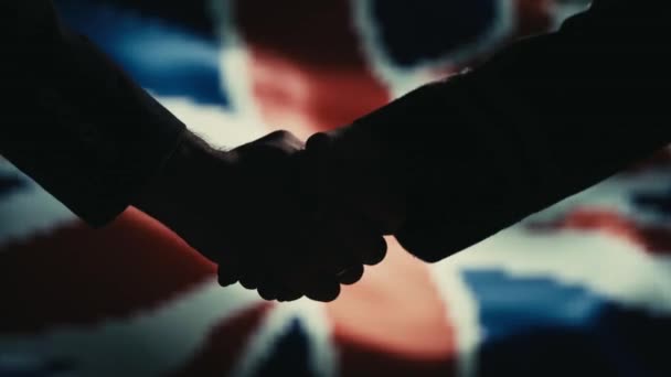 Handshake. Meerdere neemt. Verenigd Koninkrijk vlag op LED achtergrond. - Video