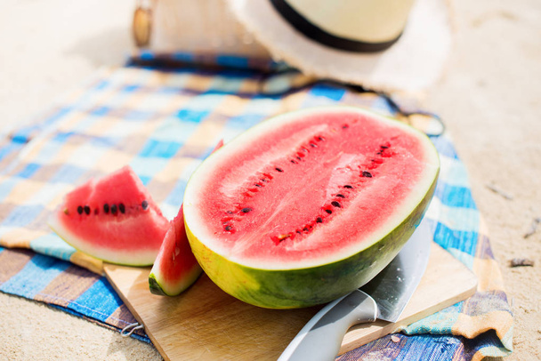 Summer picnic time on a beach. Fresh water melon - Foto, Imagen
