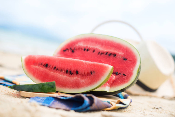 Summer picnic time on a beach. Fresh water melon - Foto, Imagen