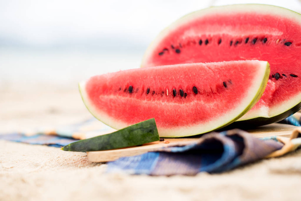 Summer picnic time on a beach. Fresh water melon - Photo, Image