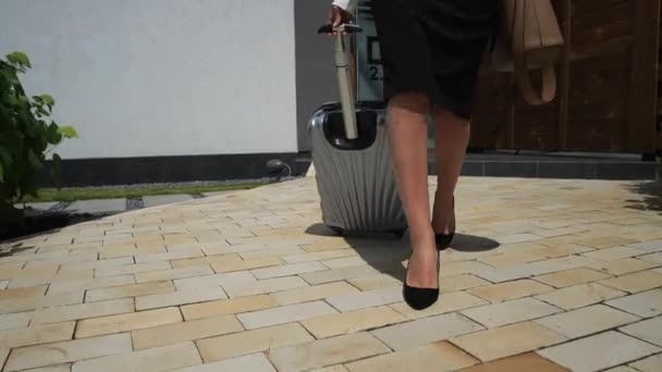 Female legs in high heel shoes walking to car - Felvétel, videó