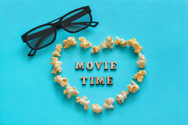 Popcorn in shape heart, 3D glasses, the text "Movie time". Still - Photo, image