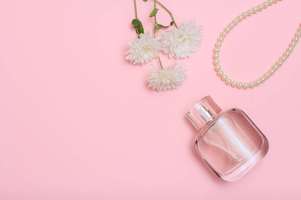 Women accessories and cosmetics on a pink background - 写真・画像