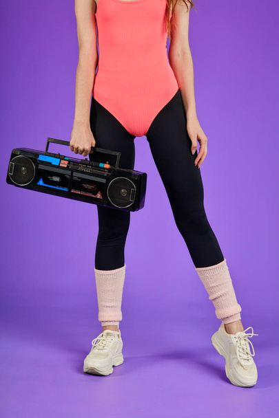 cropped shot of unrecognizable fitness woman, close up on legs and portable audio player - Fotoğraf, Görsel