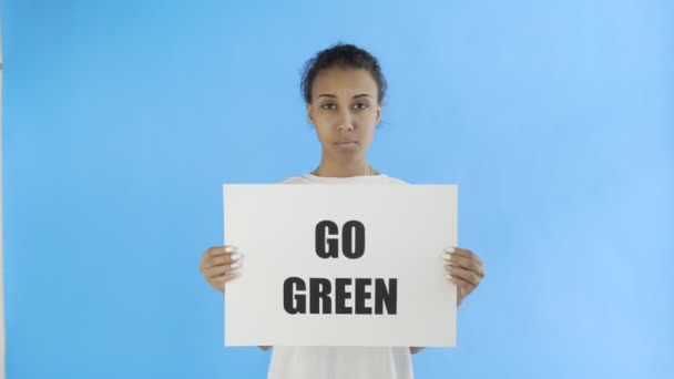 Afro-American Girl Activist With Save The Planet Poster on blue background - Footage, Video