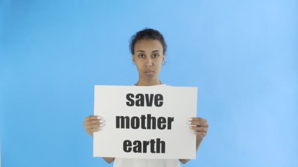 Afro-American Girl Activist With Save Mother Earth Poster on blue background - Footage, Video