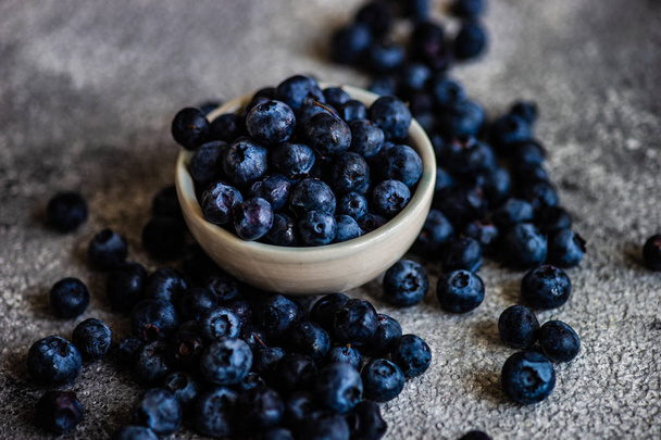 Organic blueberries on stone background - Valokuva, kuva