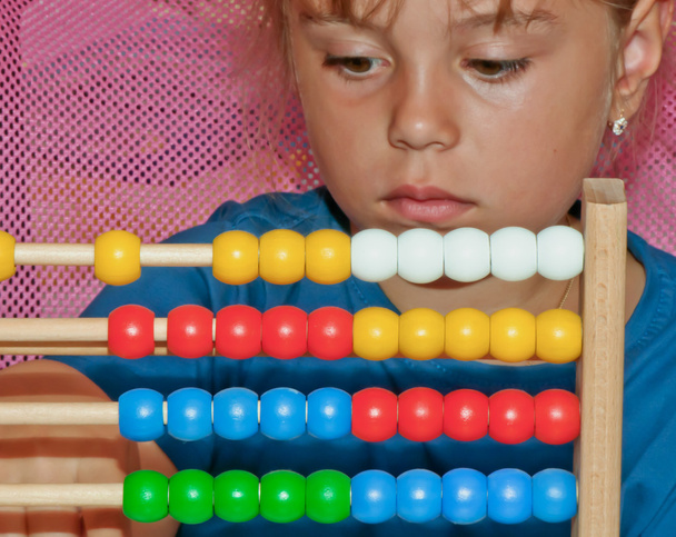 Little Girl with abacus - Фото, изображение