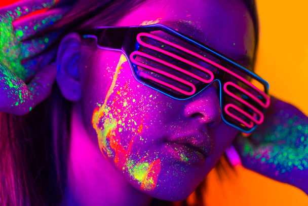 Fashion model with fluo painting on the face - Photo, image
