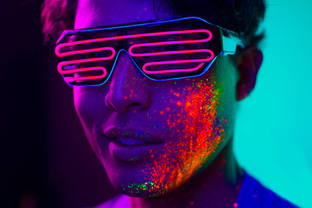 Fashion model with fluo painting on the face - Fotó, kép