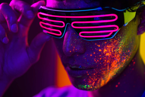 Fashion model with fluo painting on the face - Foto, immagini