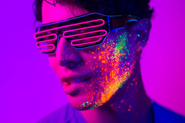 Fashion model with fluo painting on the face - Foto, Imagem