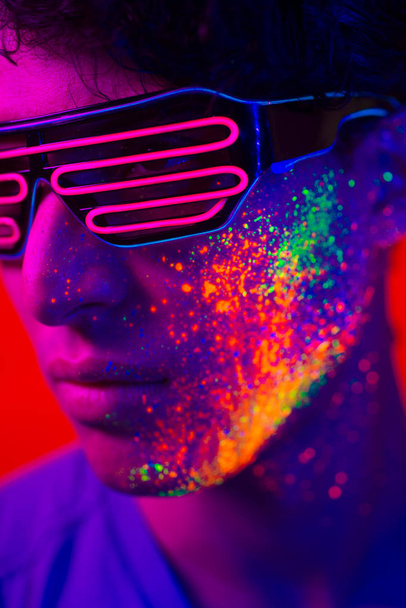 Fashion model with fluo painting on the face - Фото, зображення