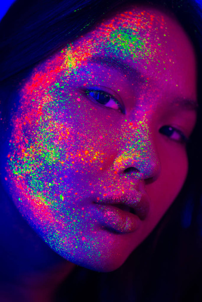 Fashion model with fluo painting on the face - Фото, зображення