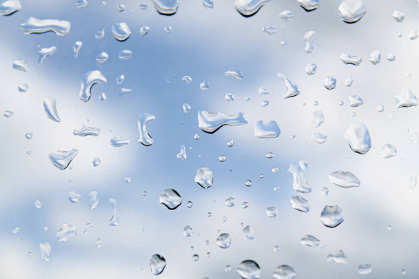 water drops (rain) on glass against a cloudy sky - Photo, Image