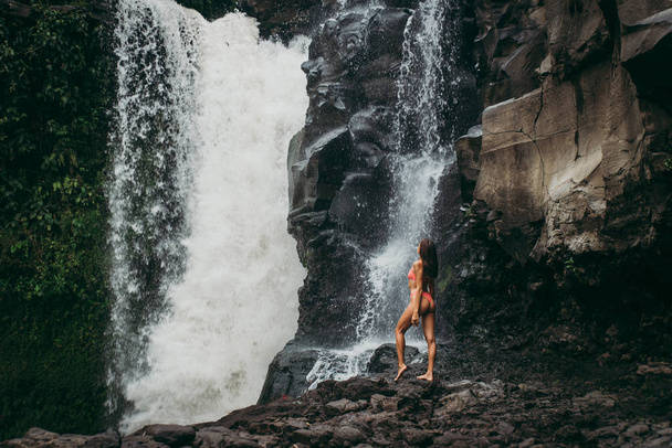 Pretty girl at Tegenungan Waterfall, Bali - 写真・画像