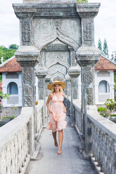 Beautiful girl at Water Palace in Bali - Photo, Image