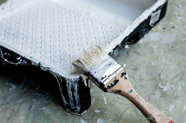 White paint, brush and tray, for painting white ceiling or trim - Fotoğraf, Görsel