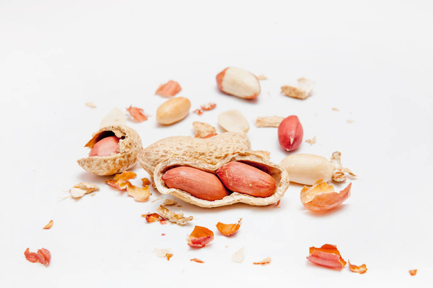 Creative layout made of hazelnut nuts, almonds, walnut, peanut, cashew on white background.Flat lay. Food concept. - Zdjęcie, obraz