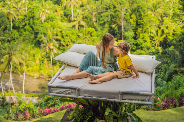 Mother and son over the jungle. Close to nature - Foto, immagini