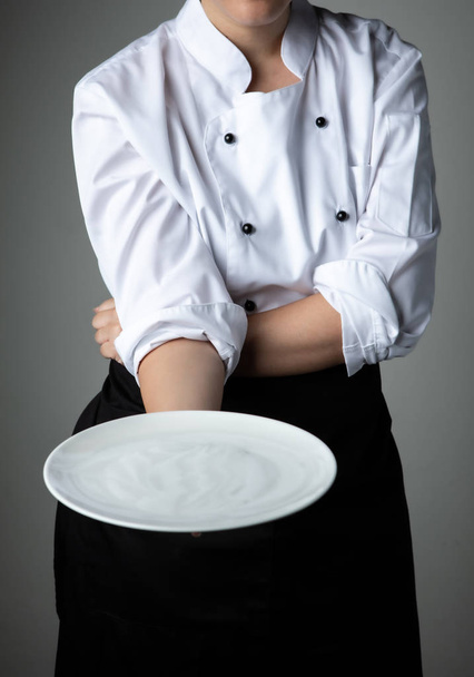 chef with white empty plate  - Photo, Image