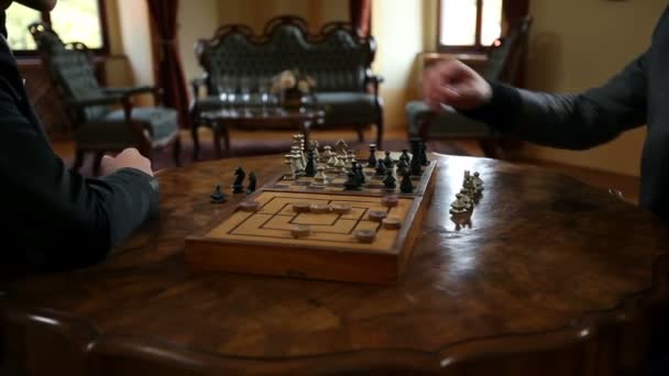 Close up of moving chess figures by two business men - Кадры, видео