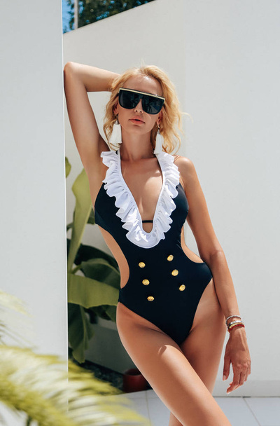 sensual woman with blond hair in elegant swimming suit posing ne - Foto, immagini