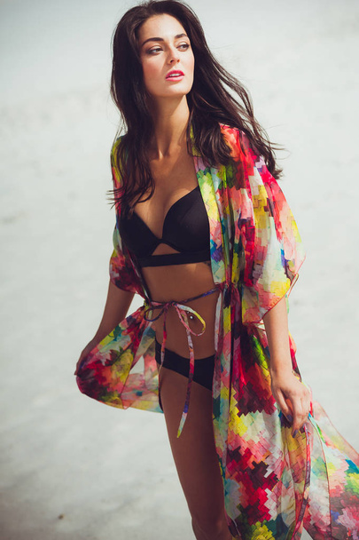 Beautiful young sensual woman on the sand in swimwear - Foto, Imagem