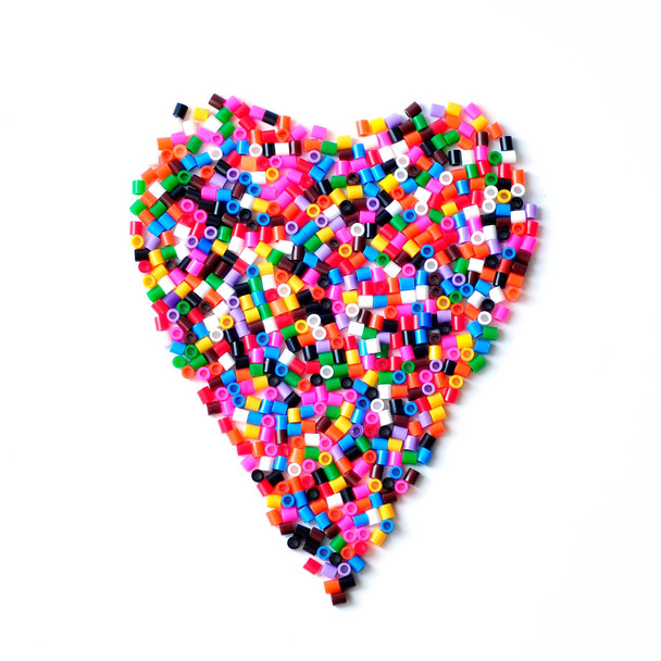 Plastic mosaic heart. Multi-colored children's mosaic - Foto, immagini