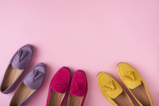 Multicolored suede moccasins shoes over pink background - Photo, Image