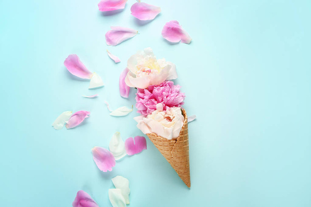 Wafer cone with beautiful peonies on color background - Photo, Image