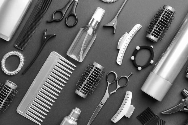 Set of hairdresser tools and accessories on dark background - Foto, imagen