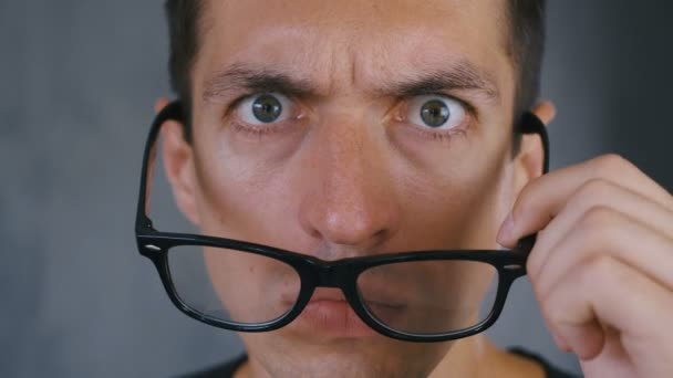 Close Up Shocked and Surprised Man takes off his glasses and looks at the camera in surprise. - Footage, Video