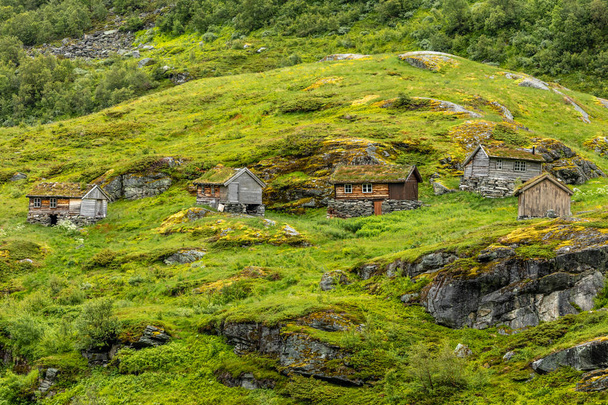 Norwegian mountain village with traditional turf roof houses, Ge - Фото, изображение