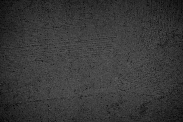 Taide musta betoni kivi rakenne tausta musta. on väri kuiva naarmuuntunut pinta seinän kansi abstrakti värikäs paperi naarmuja nuhjuinen vuosikerta sementti ja hiekka harmaa tumma yksityiskohta kattaa. - Valokuva, kuva