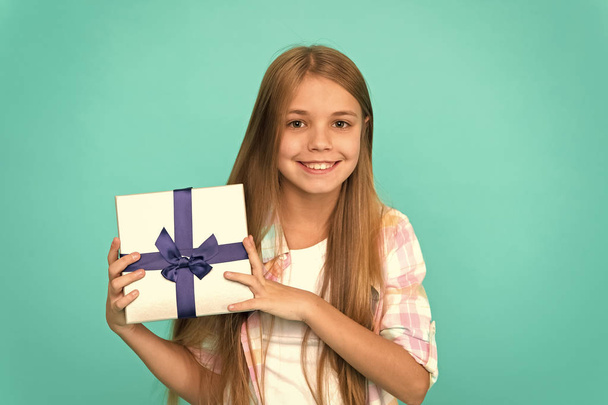 Pleasant surprise. Happy birthday concept. Girl kid hold birthday gift box. Every kid dream about such surprise. Birthday girl carry present. Making gifts. Birthday wish list. Happiness and joy - Φωτογραφία, εικόνα