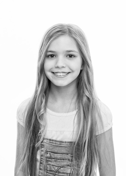 Making a big statement with huge hair. Adorable girl happy smiling with new hairstyle. Small model with blond hair. Little child with long locks of hair. Happy little girl with loose hairstyle - Zdjęcie, obraz