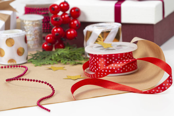 Christmas background with gifts present box, wrapping paper, ribbons, bows on white table - Foto, imagen