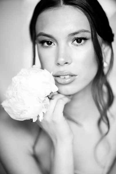 portrait of a beautiful bride with flower - Photo, Image